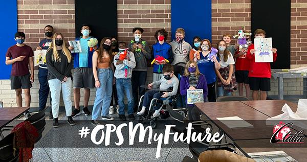 group photo of students and their creations