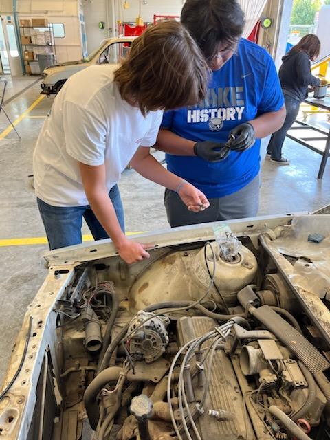 Auto Collision students learn about reassembling a car