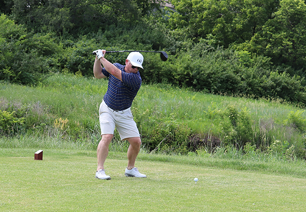photo of golfer swinging club