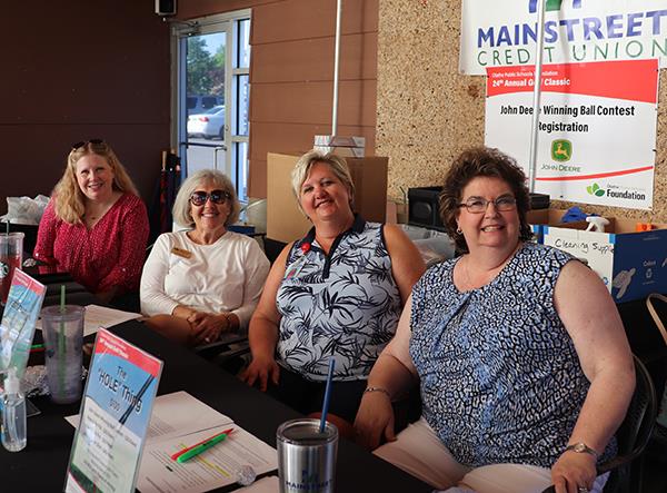 photo of women at check in table