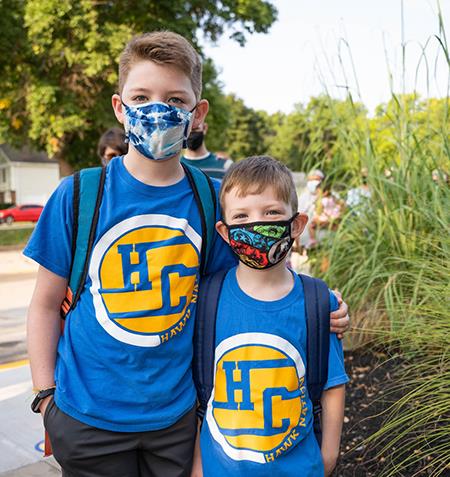 photo of two boys in matching shirts