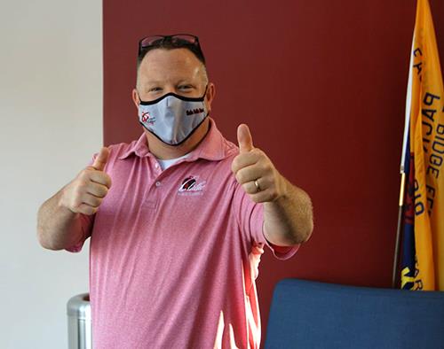 photo of superintendent giving thumbs up