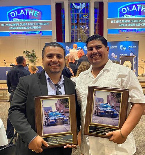 photo of men holding award plaques