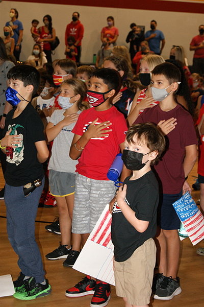photo of students standing at attention