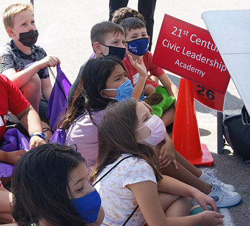 photo of students listening closely
