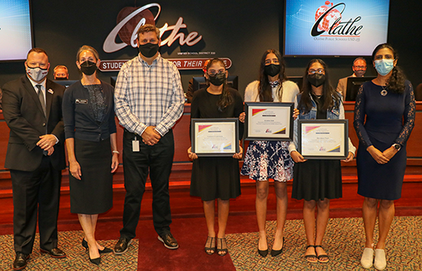 photo of girls with principal and coach