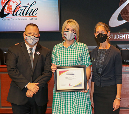 photo of superintendent, board member and honor