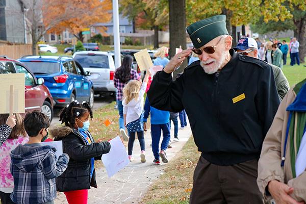 veteran salutes students in parade
