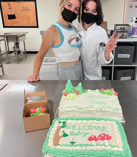 photo of two girls and decorated cakes