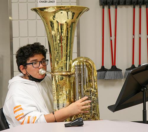 boy playing tuba