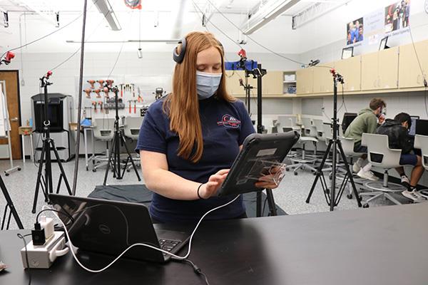 Maggie wears the EEG device