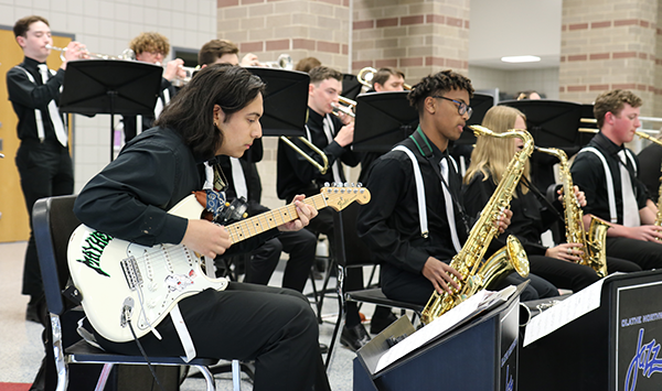 close-up of high school guitarist performing