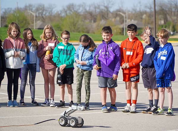 students watch a robot move