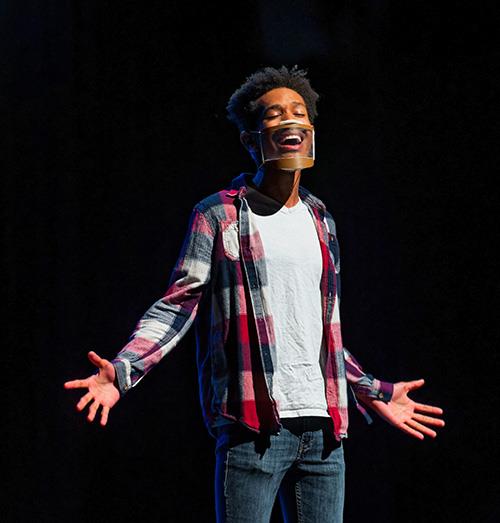 teen sings on stage