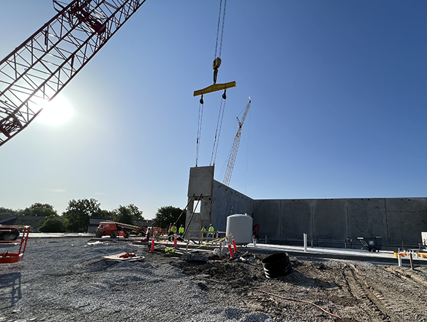 crane lifts wall panels into place