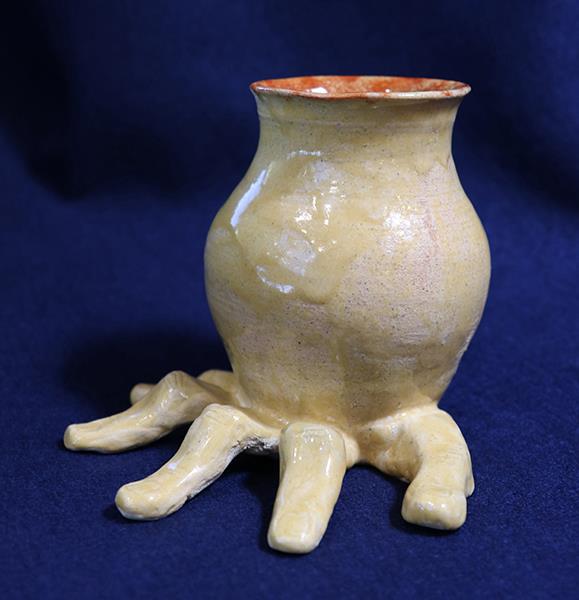 ceramic vase with fingers as the base