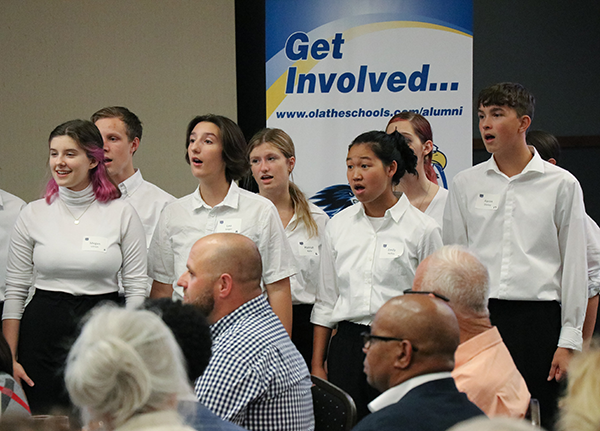 high school singers perform for the crowd