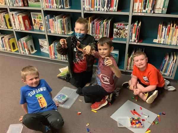 Students work together building with Legos.