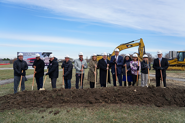 district leaders and students prepare to shovel dirt