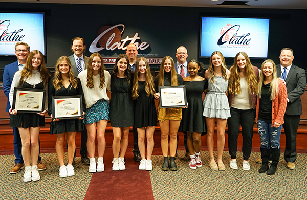 gymnasts being recognized by the board