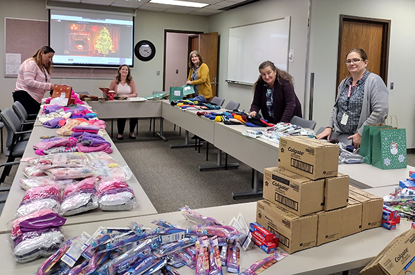 staff sort donated toiletries