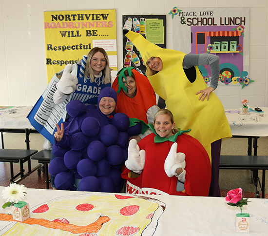 people wearing fruit and vegetable costumes