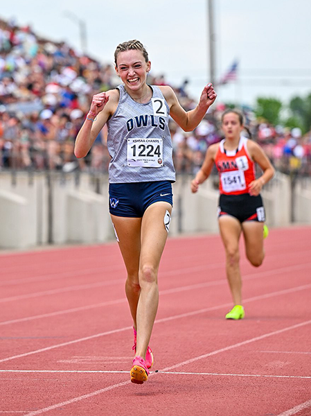 girl running on track and winning