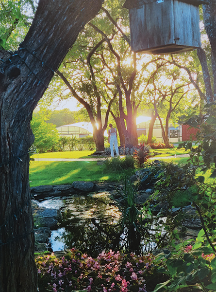 photo of woman walking in a beautiful garden