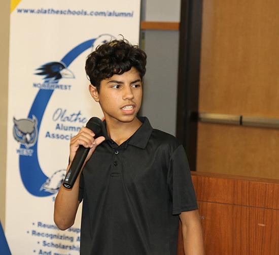 teenage boy holding microphone