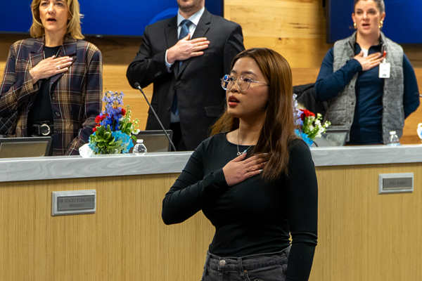 Haley leads the pledge of Allegiance at the board meeting