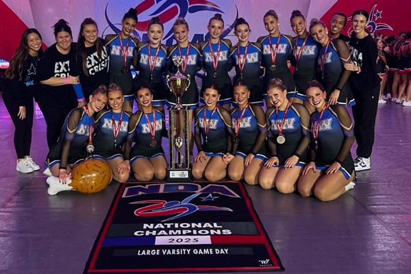 dance members surround their national trophy