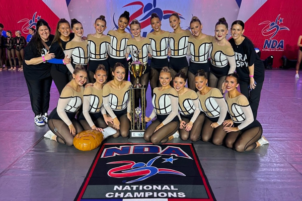 dancers surround their second national trophy