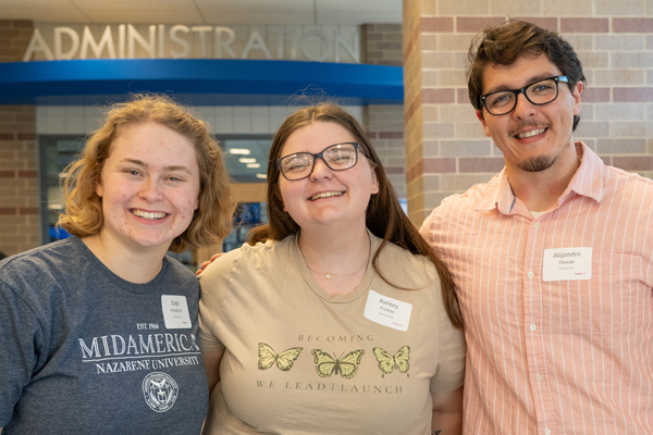 three volunteers enjoy the celebration