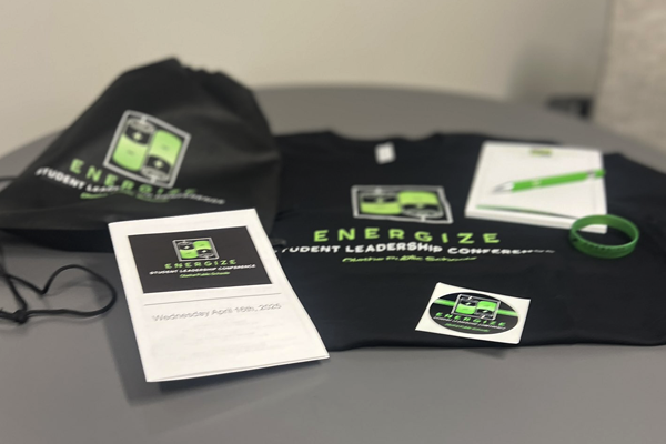 backpack, wristband, and T-shirt from conference