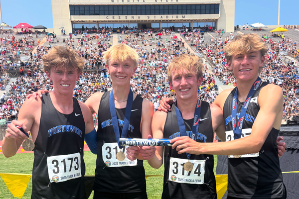 team holds track relay baton while wearing their championship medals