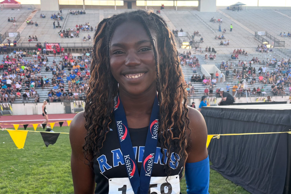 Michenainda wears her championship medal